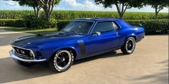 Blue classic Mustang with modification plate approval